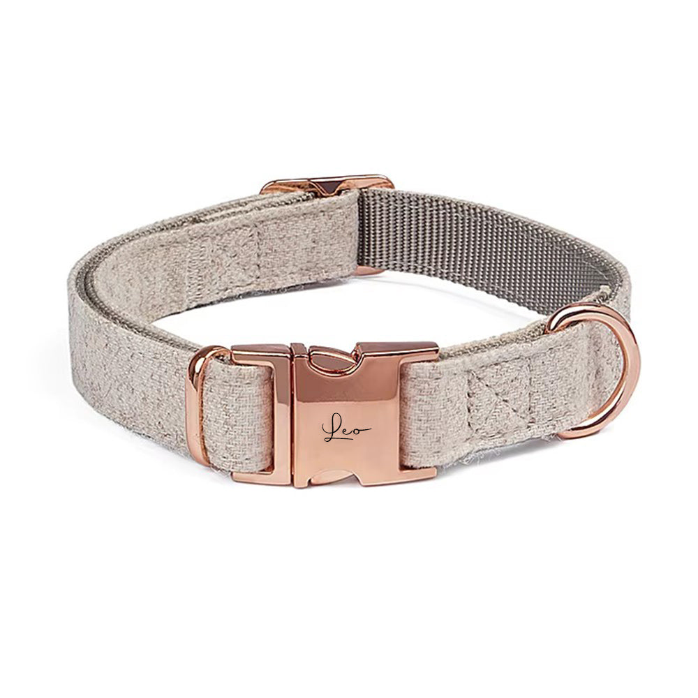 Dog collar with rose gold hardware on a white background