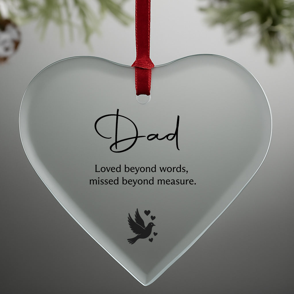 Heart-shaped glass ornament with 'Dad' and a quote on a gray background
