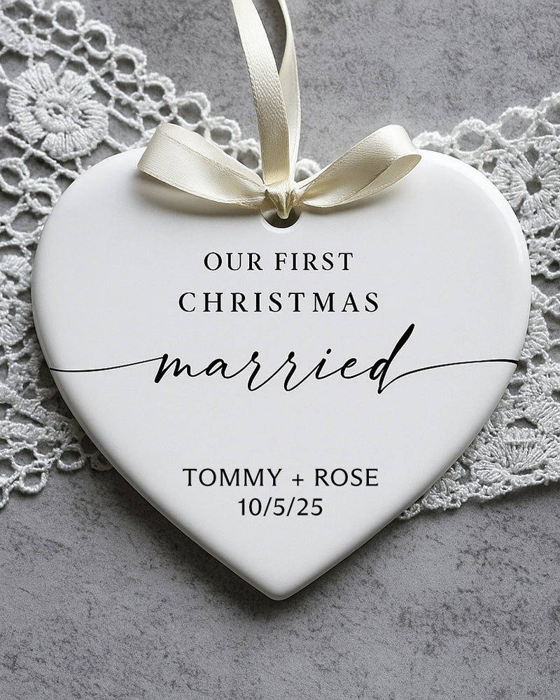 Heart-shaped ornament with 'Our First Christmas Married' text on a lace background
