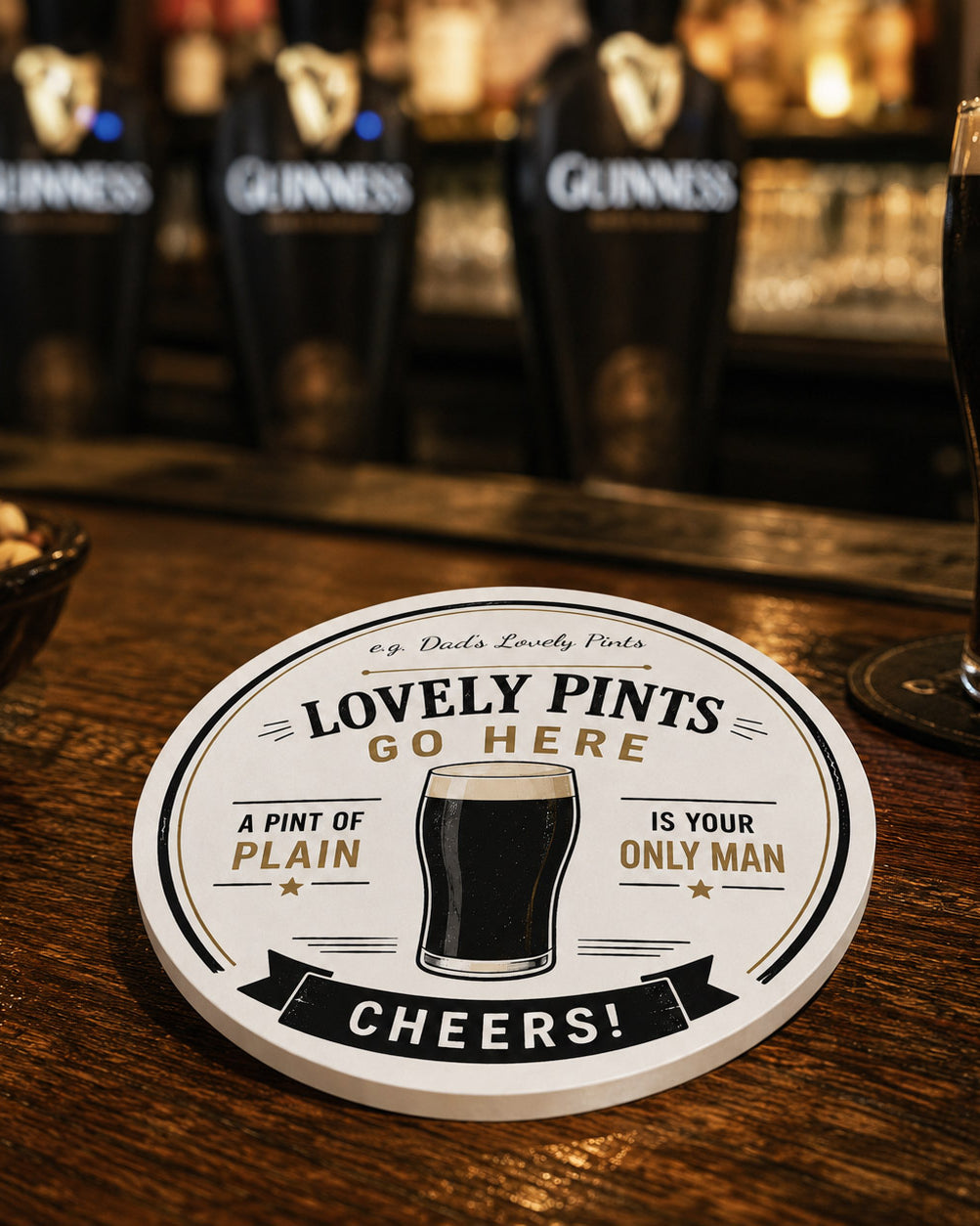 Round personalised ceramic coaster with a glass of beer and text on a white background