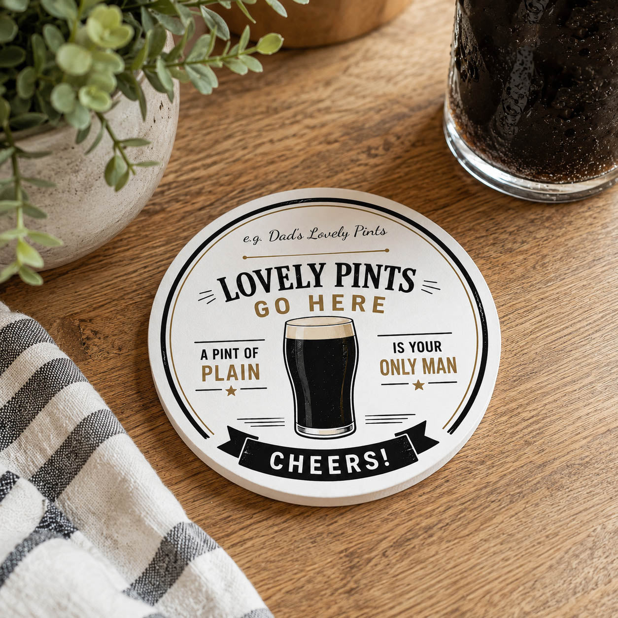Round personalised ceramic coaster with a glass of beer and text on a white background