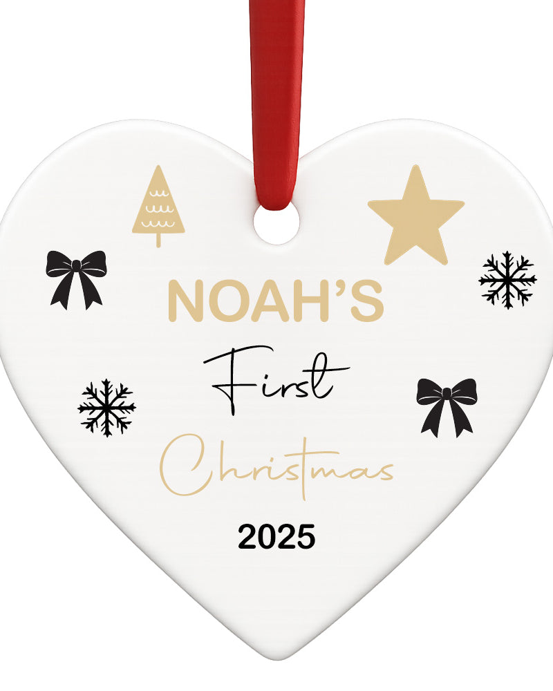 Heart-shaped ornament with 'Noah's First Christmas 2025' text and decorative elements on a white background.