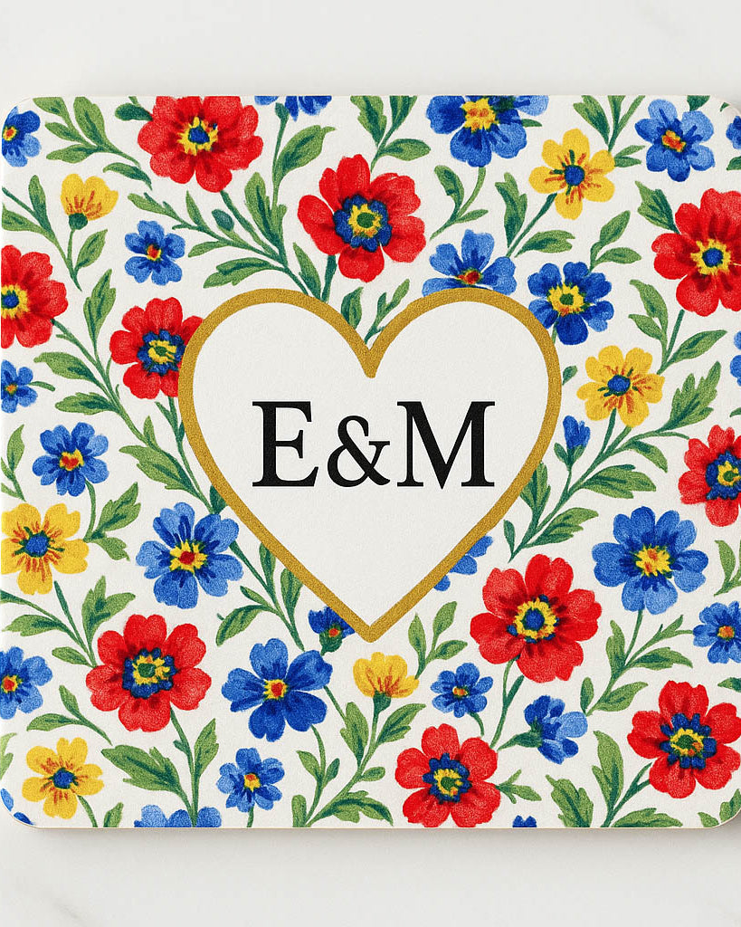 Decorative cpoasterwith floral pattern and 'E&M' initials