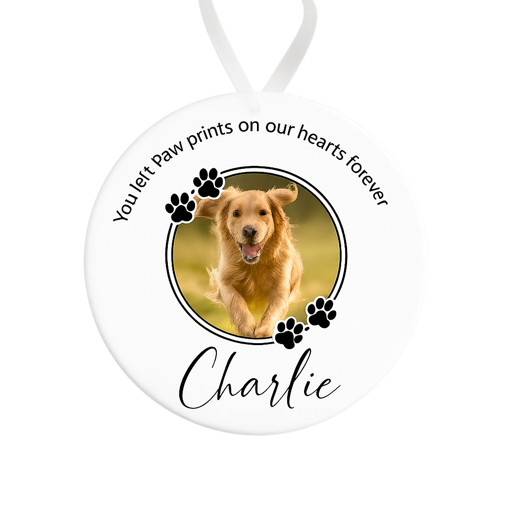 Memorial ornament with a photo of a dog named Charlie and text 'You left paw prints on our hearts forever'.