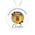 Memorial ornament with a photo of a dog named Charlie and text 'You left paw prints on our hearts forever'.