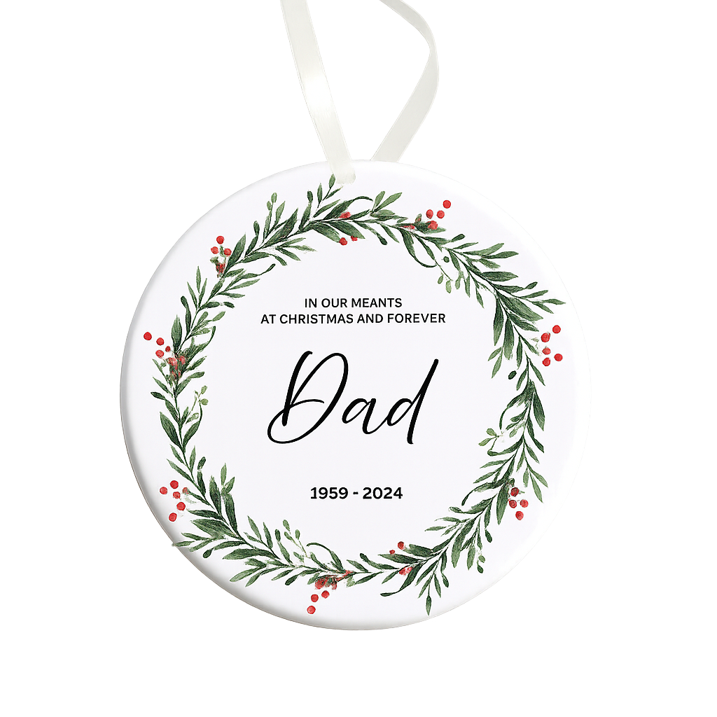 Round Christmas ornament with greenery design and text 'Dad' and year range on a white background
