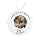 Round ceramic ornament with a photo of a cat named Ellie and text on a white background