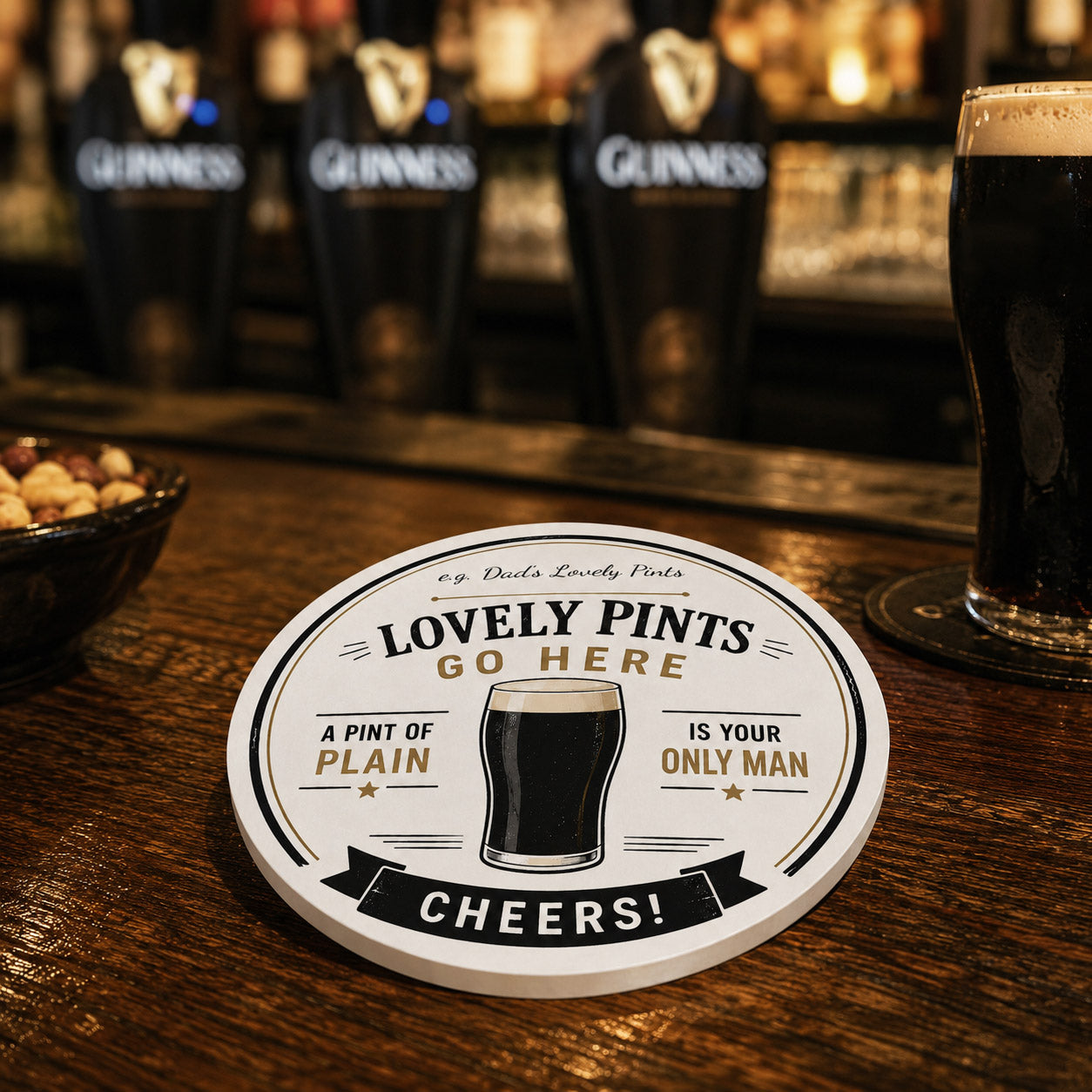 Round personalised ceramic coaster with a glass of beer and text on a white background