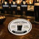 Round personalised ceramic coaster with a glass of beer and text on a white background