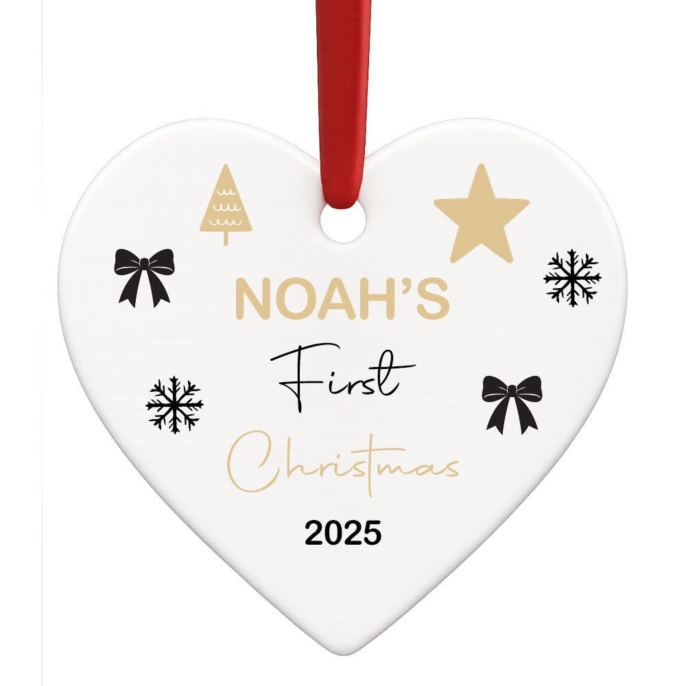 Heart-shaped ornament with 'Noah's First Christmas 2025' text and decorative elements on a white background.
