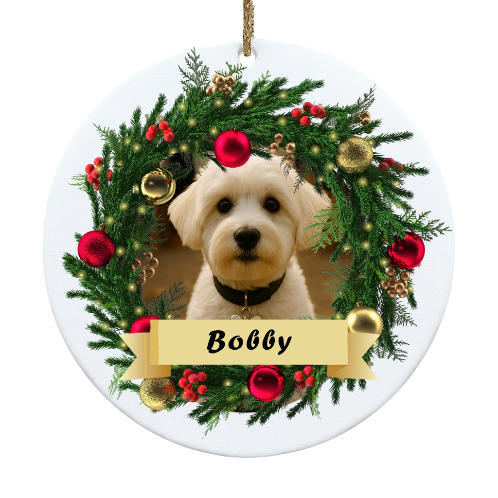 Decorative Christmas ornament with a dog's face surrounded by a wreath and the name 'Bobby'.